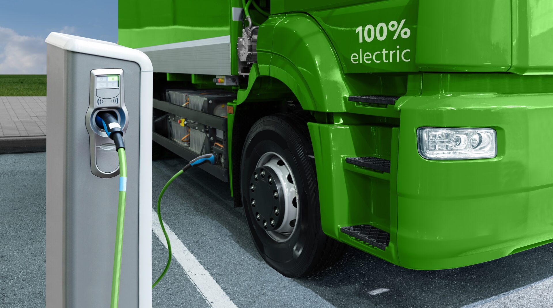 Green,Electric,Truck,Is,Charged,From,The,Charging,Station.,Concept